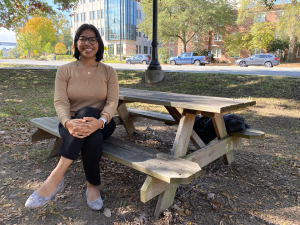 Photo of Alma Solis sitting on a picnic table