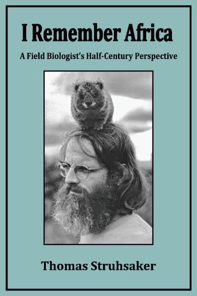 Book cover with the words "I remember Africa, a field biologists half-century perspective, and a photo of Thomas Struhsaker with a wombat on his head